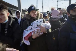 Father carries his baby