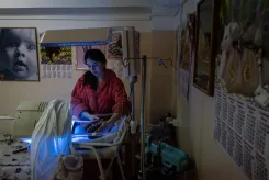  A woman tends to her newborn baby 