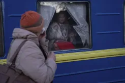 Ludmila, left, says goodbye