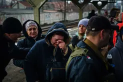 A woman breaks down in tears 